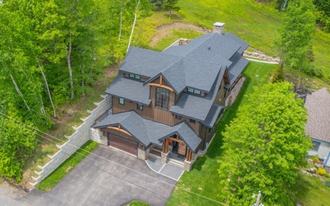Aerial view of Destiny Lodge surrounded by forest at Mount Snow