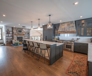 Lower-level game room with pool table and bar